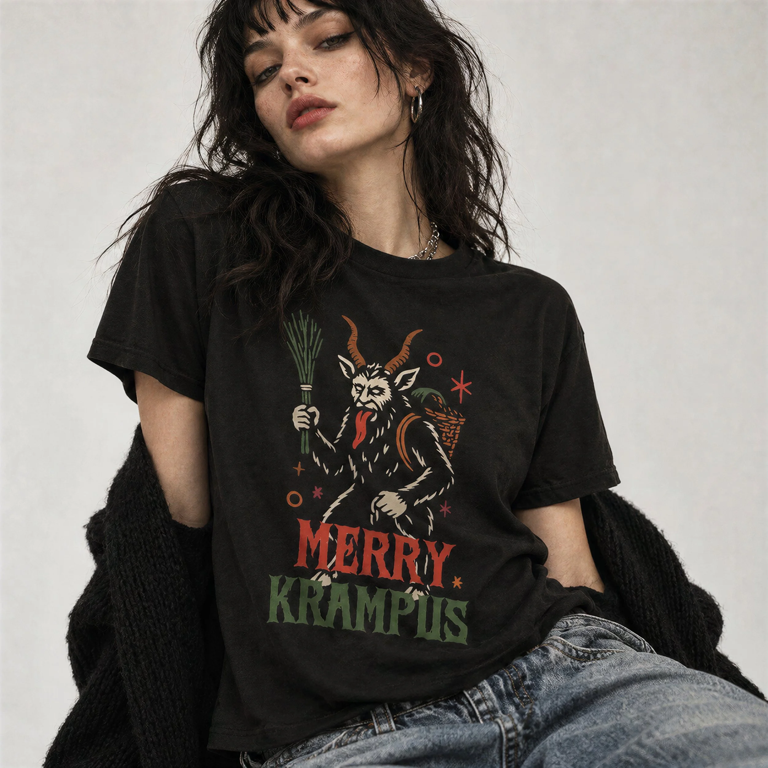 Model wearing NyxAbbey Merry Krampus black T-shirt with large Krampus back graphic