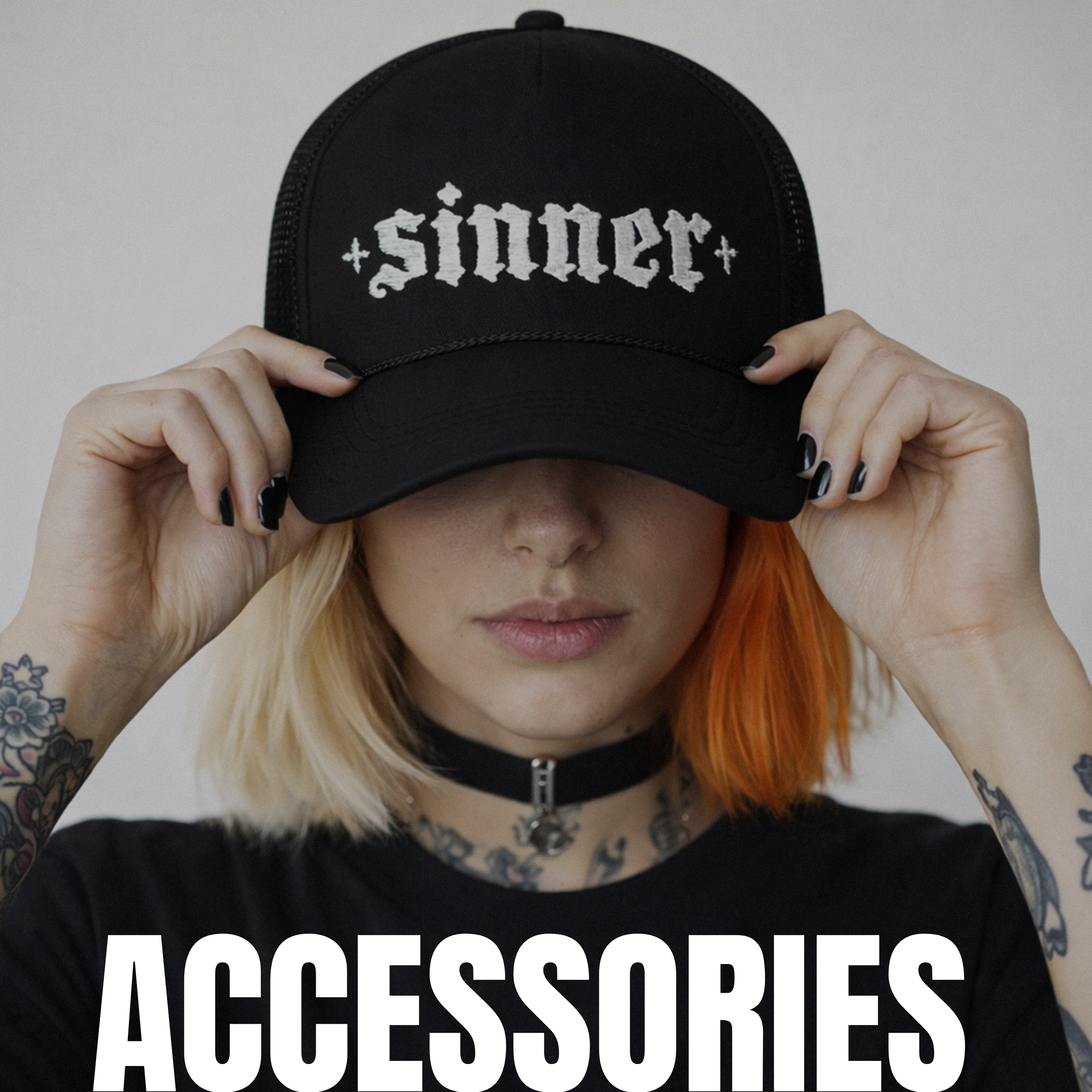 A young woman with orange and blonde hair holding a black baseball cap with the word "sinner" embroidered on it, and bold white text "ACCESSORIES" at the bottom of the image.