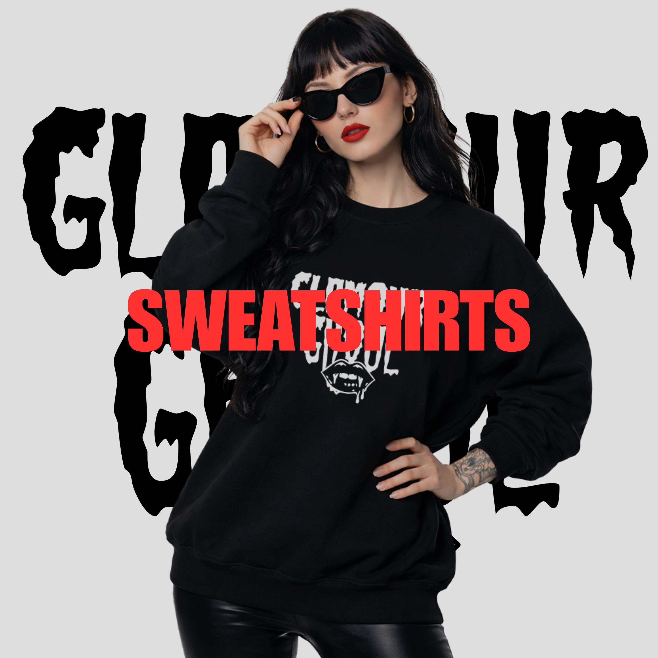 A woman with dark hair, sunglasses, and red lipstick wearing a black sweatshirt that says 'GUILTY' in white letters, standing in front of a gray background with the word 'GUILTY' in black and red text, holding the sunglasses with one hand.