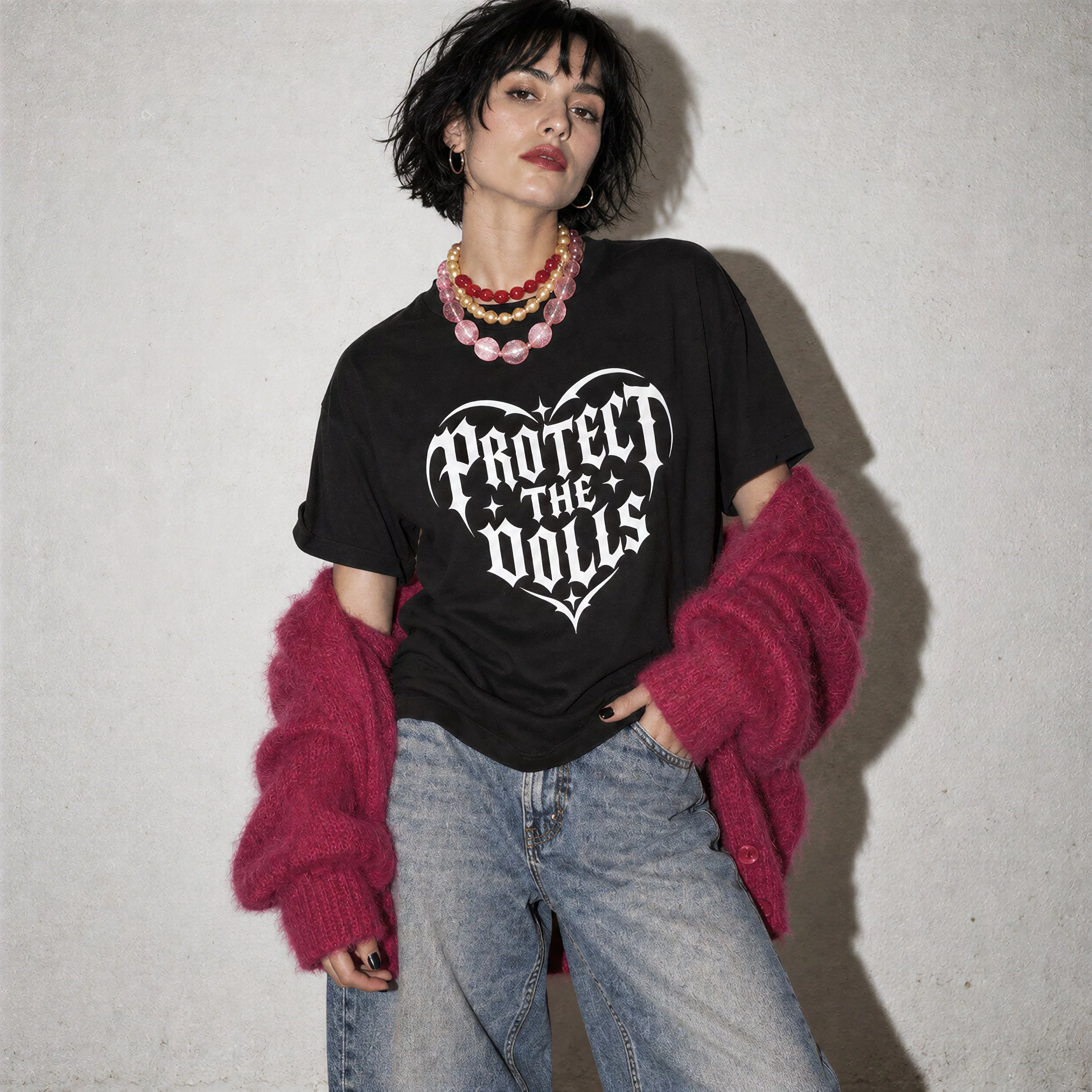 Model wearing NyxAbbey Protect The Dolls black alternative graphic T-shirt