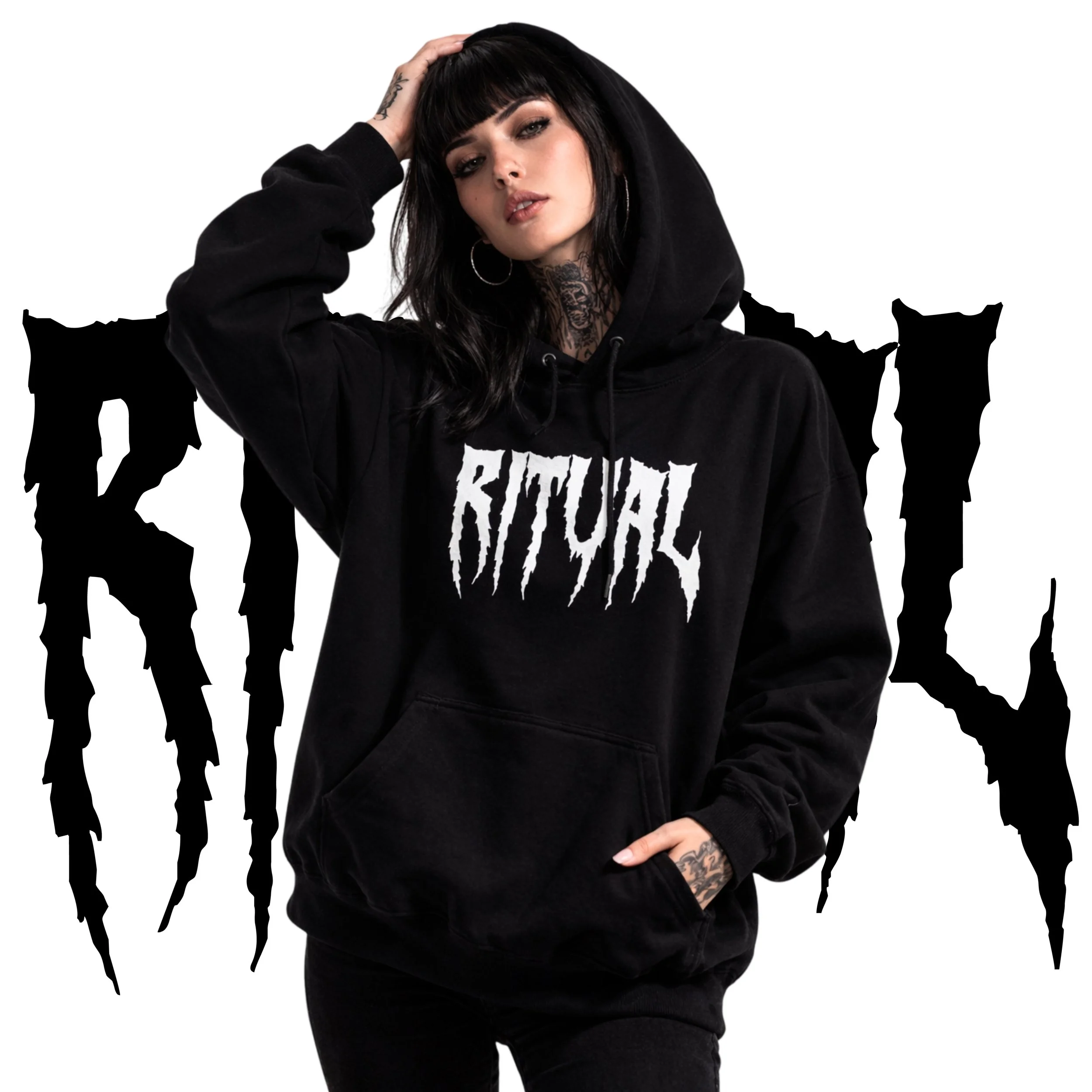 Young woman with tattoos wearing a black hoodie with 'BITE YOUR' written on it, standing in front of a Monster Energy logo background.