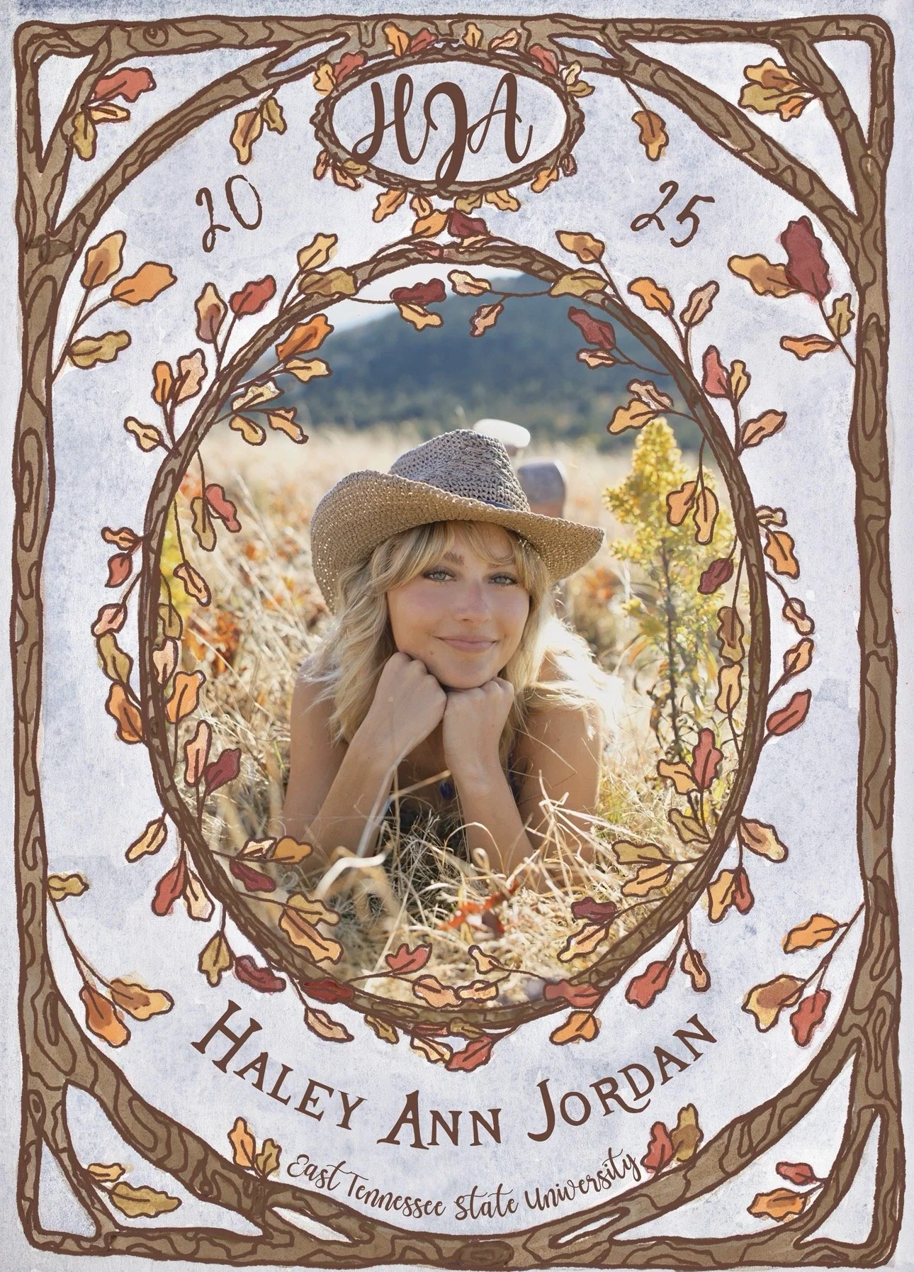 This graduation announcement features a watercolored blue background with a photo of the graduate framed in drawn tree branches with autumn leaves of red, orange, and yellow.