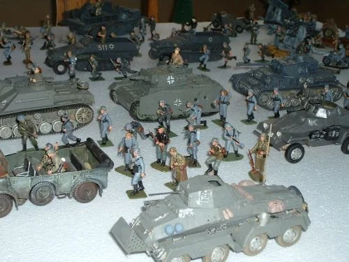 Armored columns grind forward through the frozen steppe, infantry clinging to steel as winter locks the front in place.