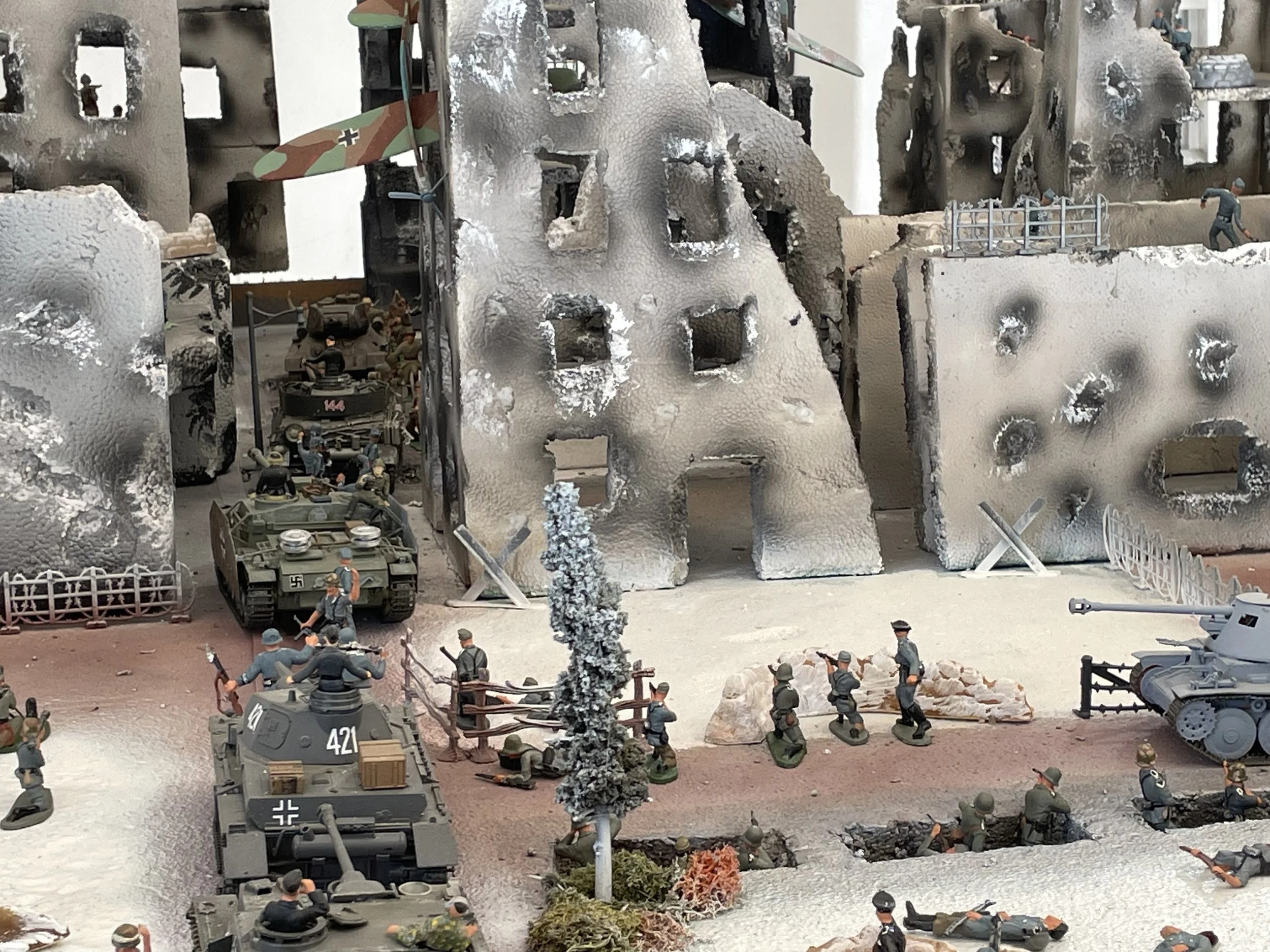 A central armored thrust, closely supported by infantry, pushes into the shattered streets of Kharkov only to meet immediate Soviet resistance. Even amid the ruins, defenders contest every approach, turning the advance into a brutal fight for each bl