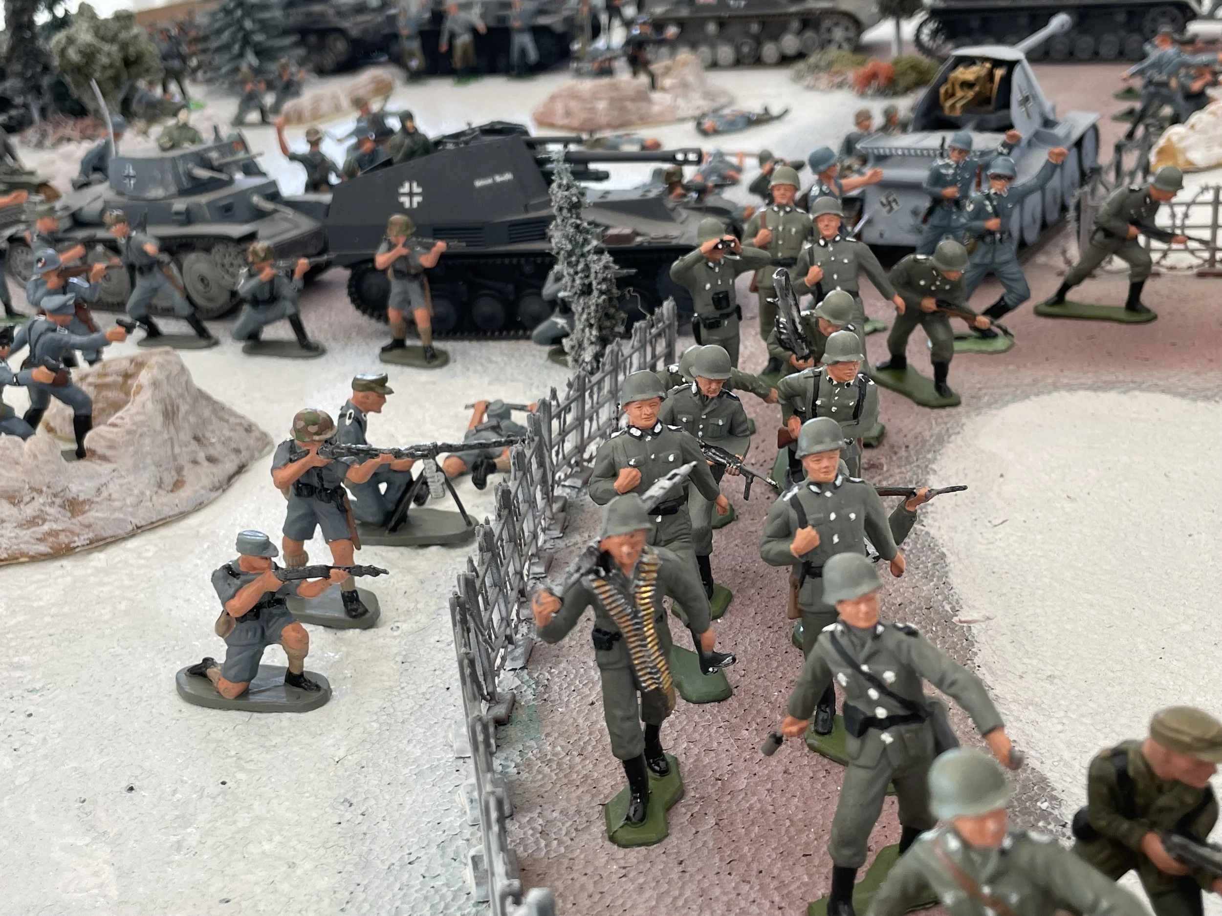 Assault forces move into position as the leading columns prepare to penetrate the outskirts of Kharkov. In the brief stillness before the attack, men and machines gather under palpable tension—the final calm before the storm breaks over the city.