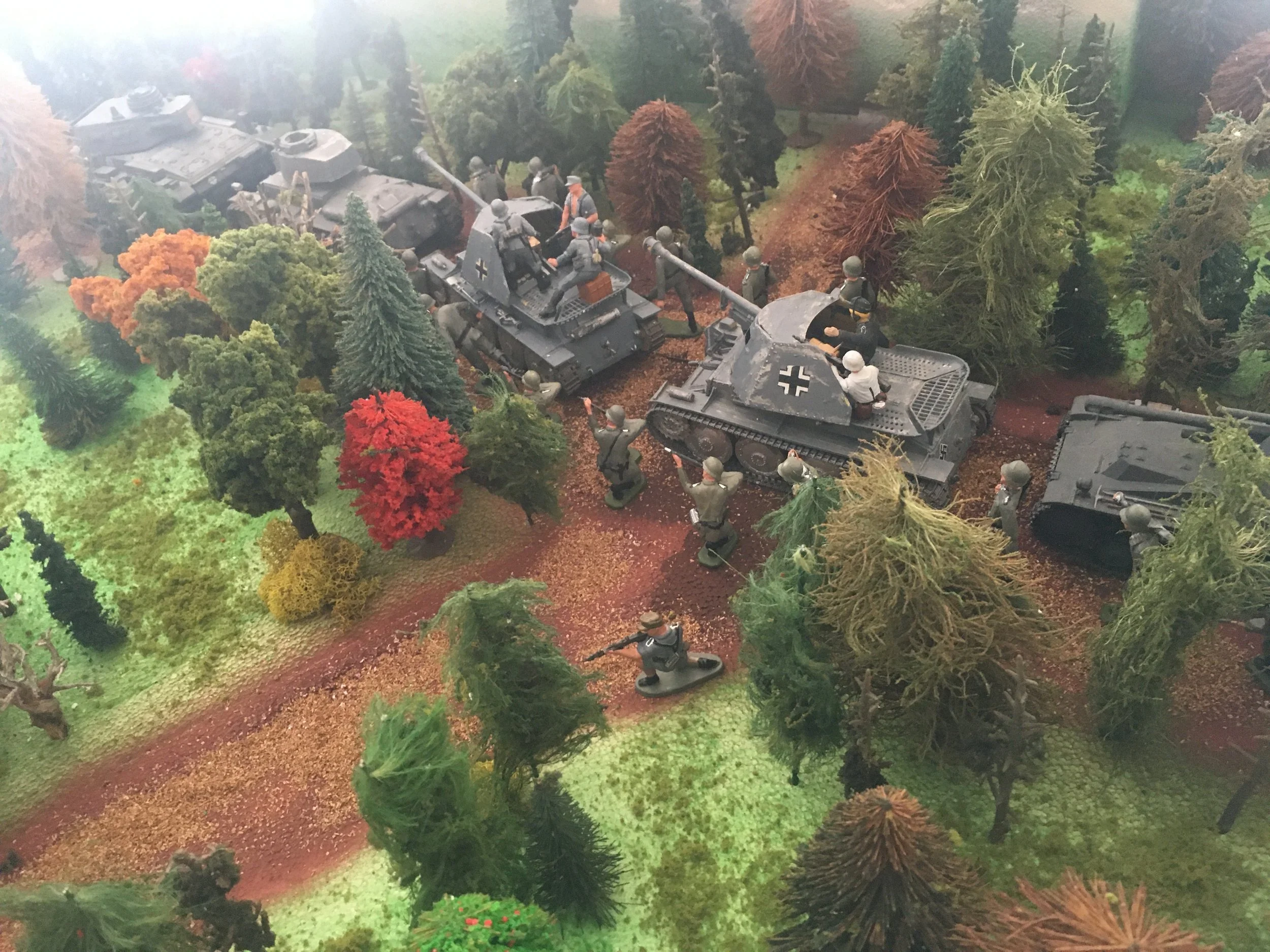 Panzer columns advance under autumn canopy, the calm before the storm that would become the Battle of the Bulge.