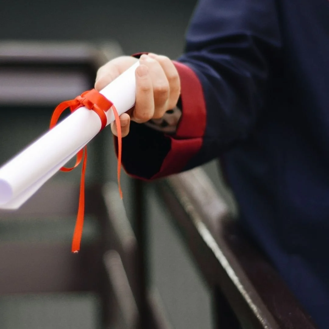 student being handed a diploma