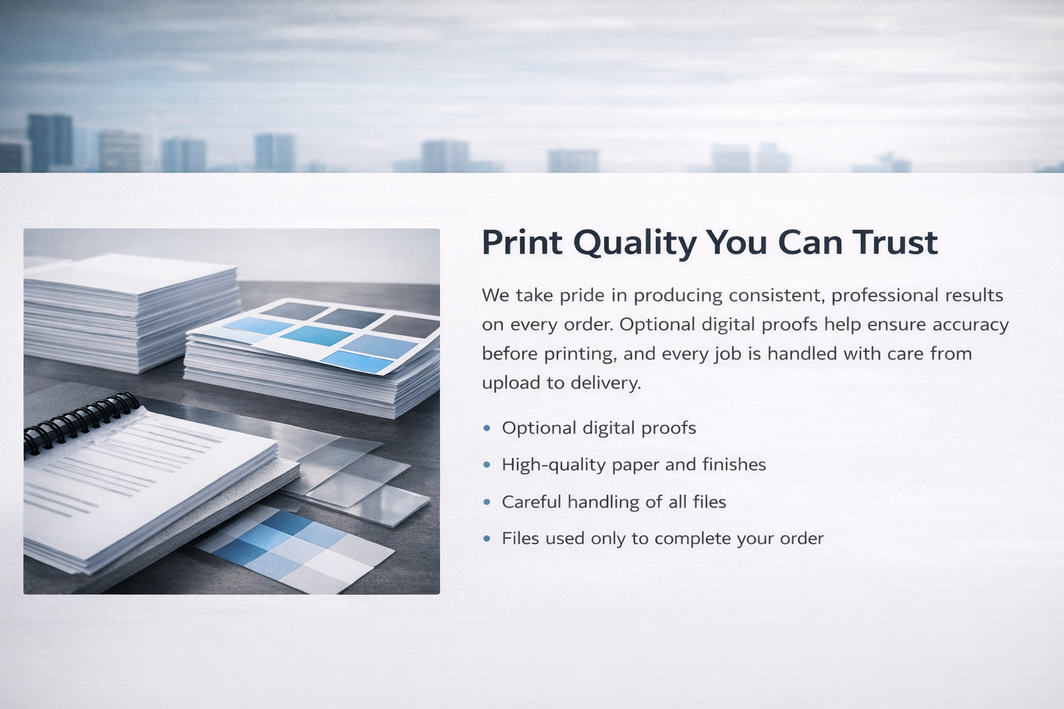 A digital illustration showing stacks of printed papers, color swatches, and sample papers, with a cityscape background.