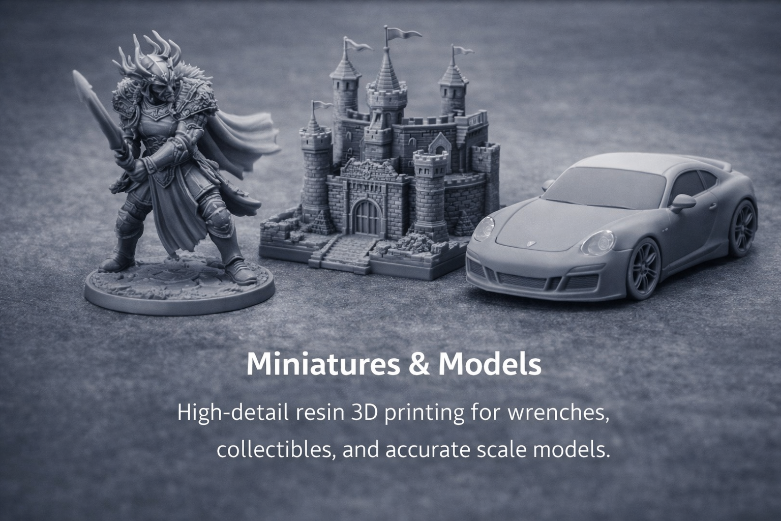 Gray miniature figurine of a warrior with a sword, a detailed gray model castle, and a gray sports car model on a gray surface with white text reading 'Miniatures & Models' and a description about high-detail resin 3D printing for wrenches, collectibles, and scale models.