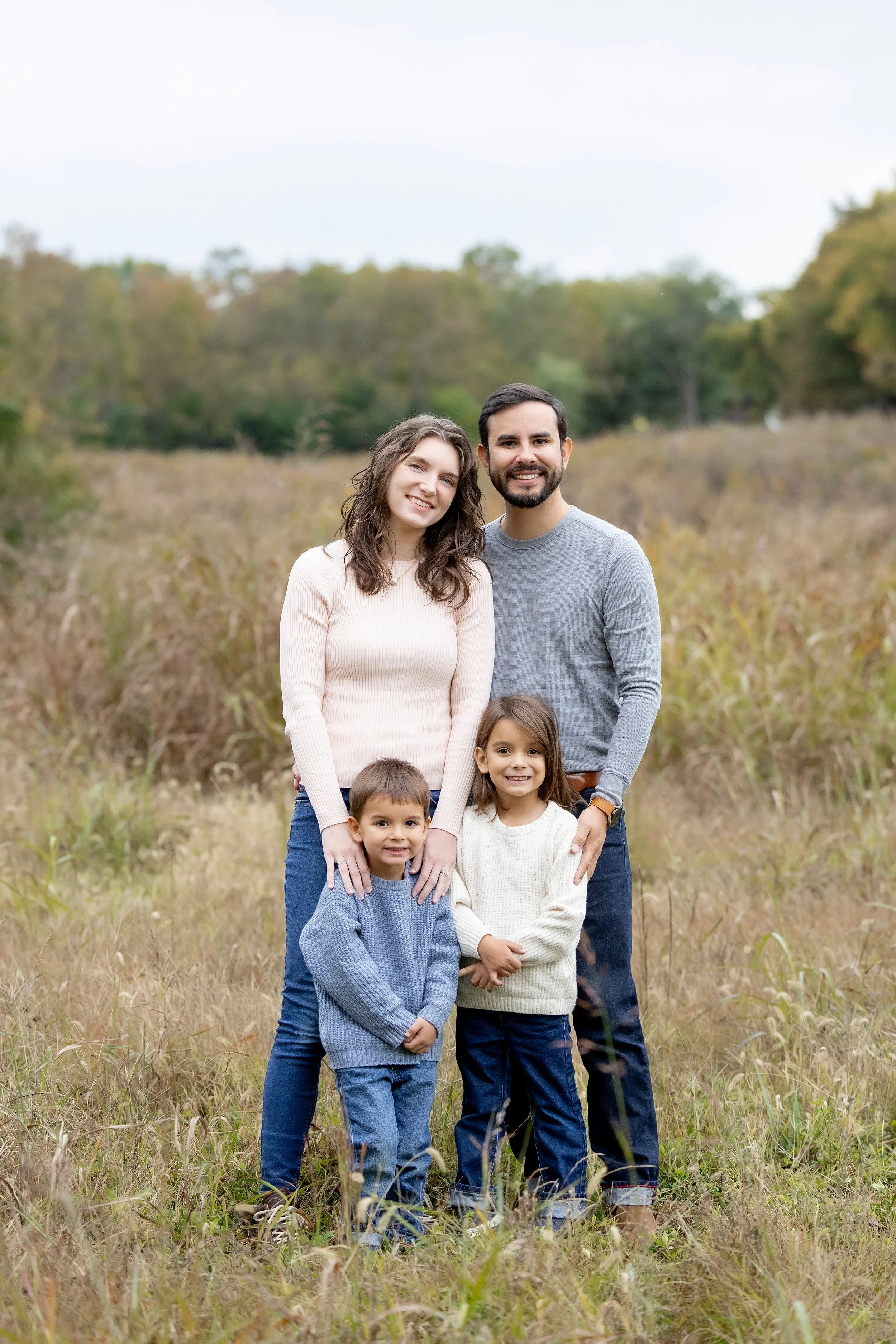 Chelsea Kirk and Family standing together