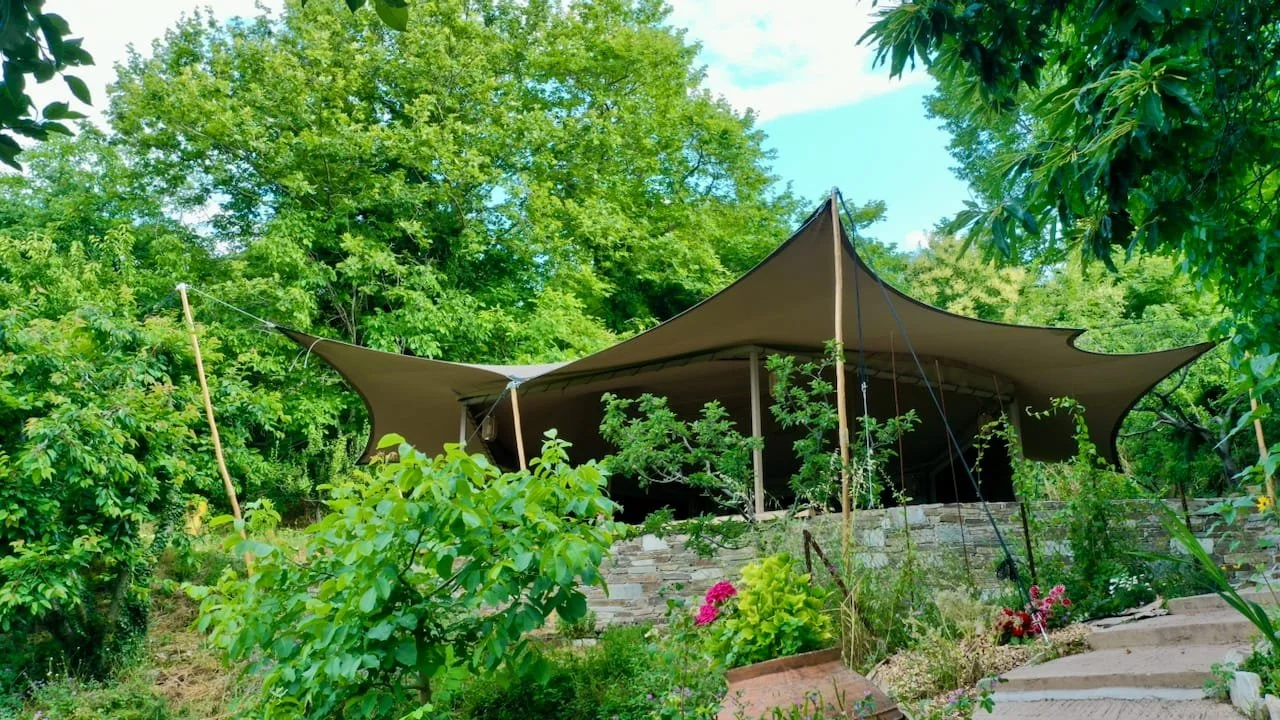Stretch Tent in a Lush Garden Setting (1).jpeg