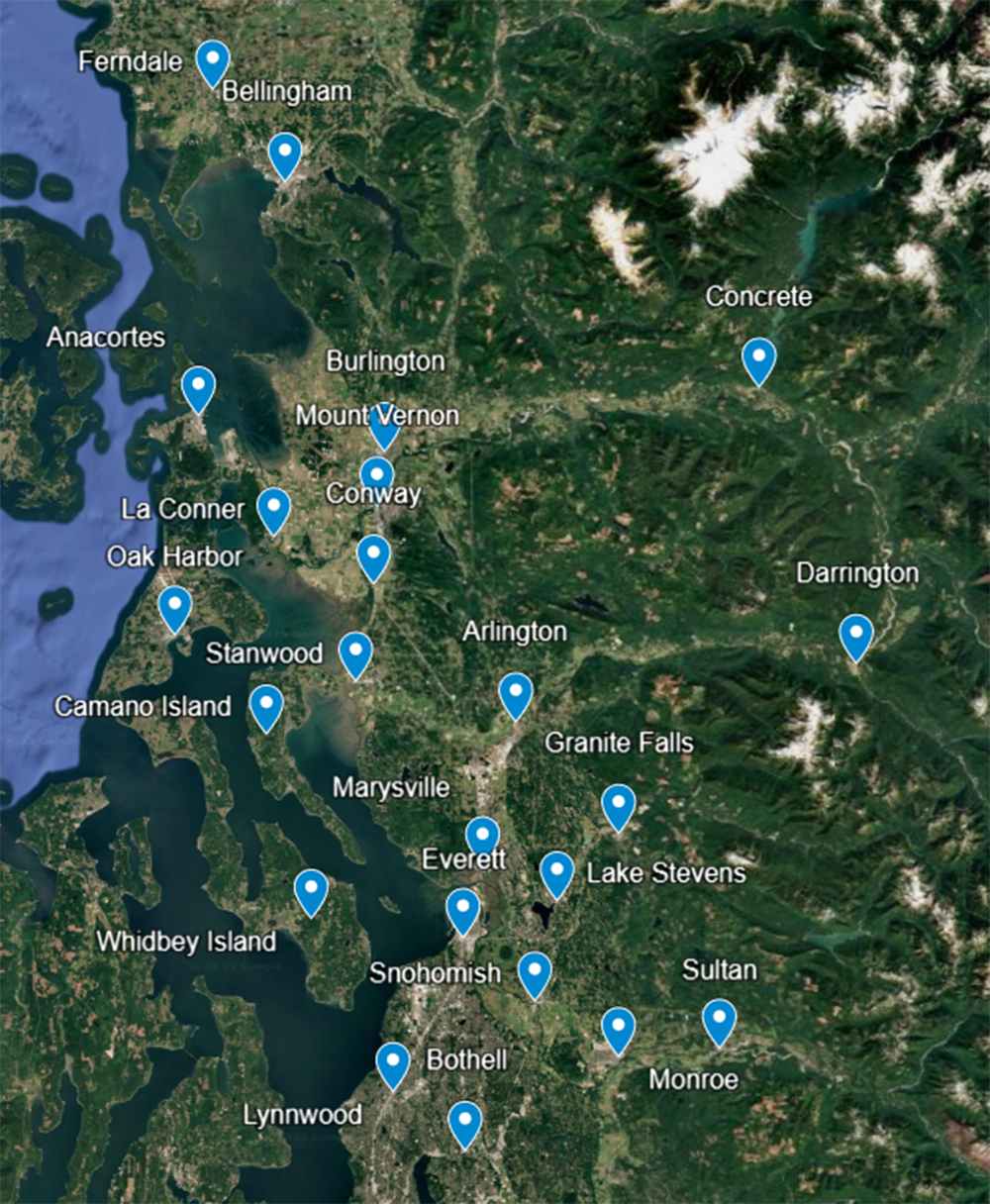 Satellite map showing locations of various towns and landmarks in western Washington state, including Seattle, Everett, Mount Vernon, Bellingham, and many islands in Puget Sound.