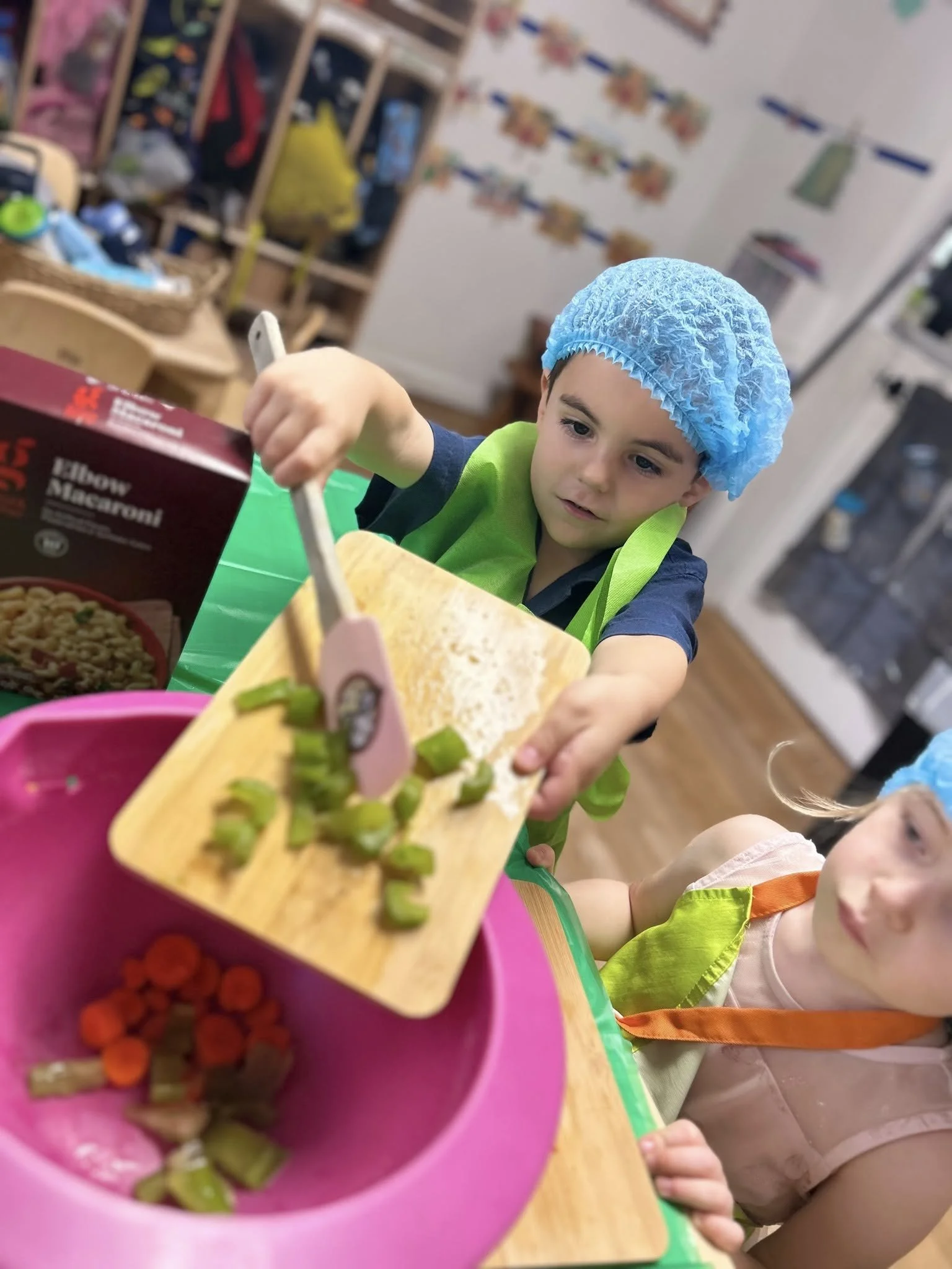 a preschooler helping making stuffing for a thanksgiving themed meal