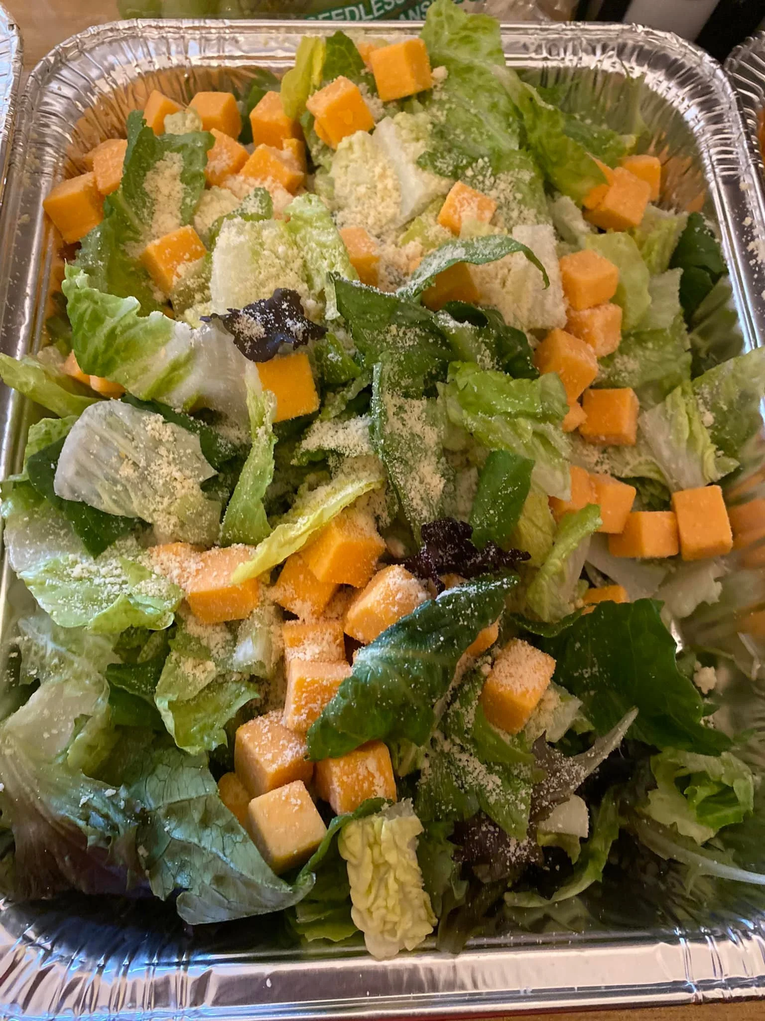 A fresh salad with cheese cubes