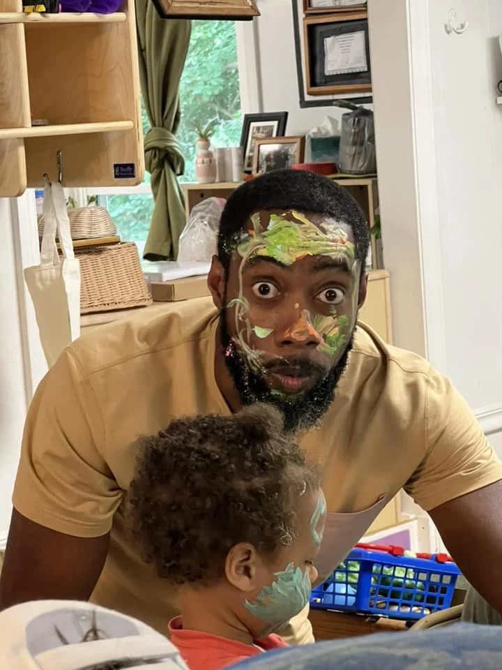 A dad caught with paint all over his face