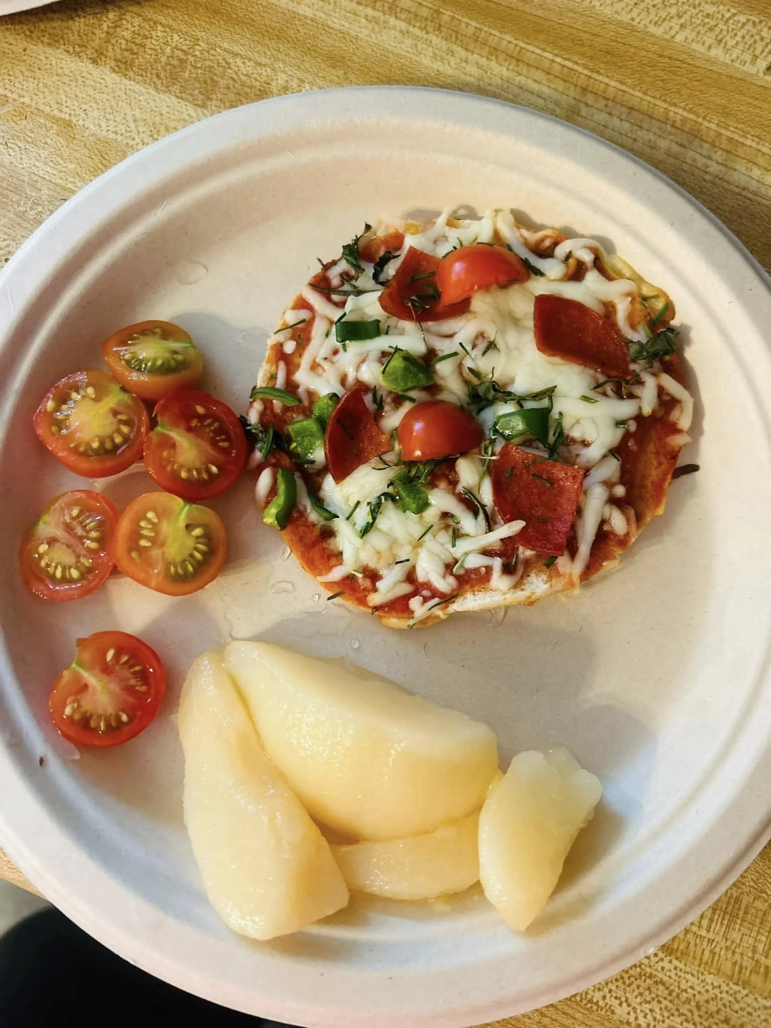 Pepperoni pizza, fresh tomatoes, and pears