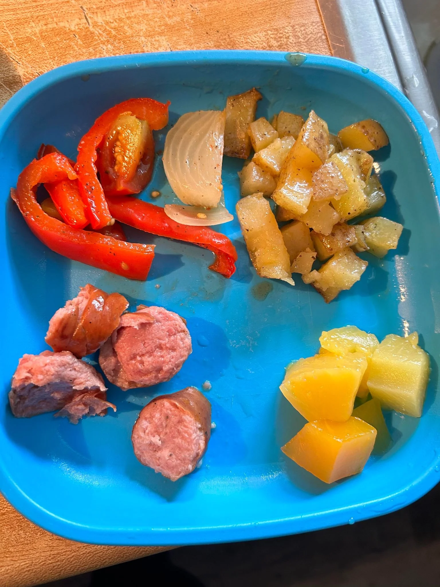 Sausage, peppers, onions, potatoes, with peaches and pineapple 