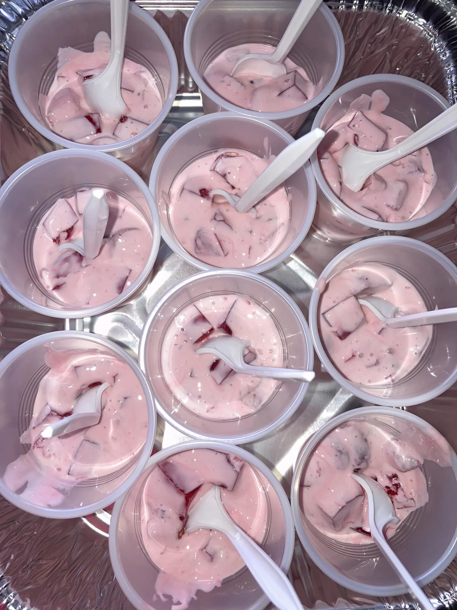 Cups with strawberry yogurt and fruit 