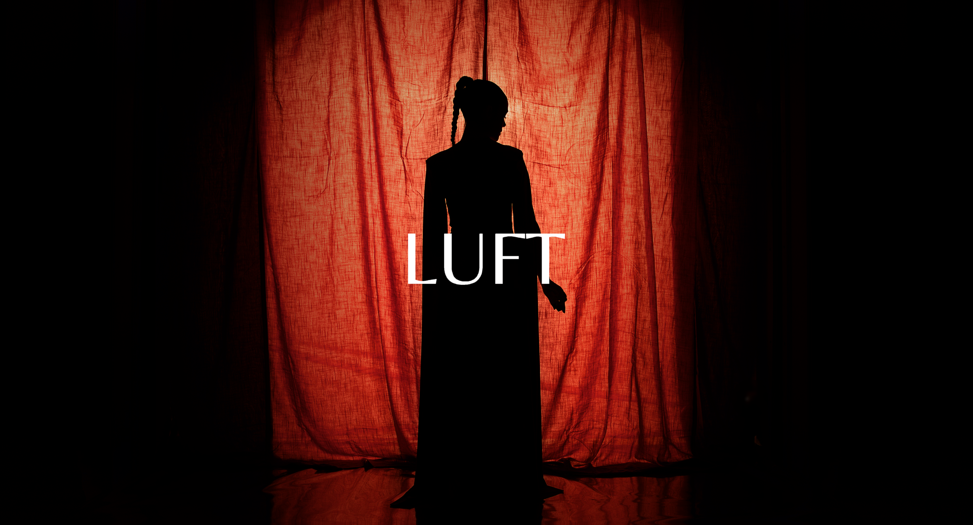 Silhouette of a woman with braided hair in front of a red curtain, with the word "LUFT" overlaid.