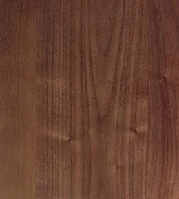 Close-up of a wooden surface with visible grain and knots.