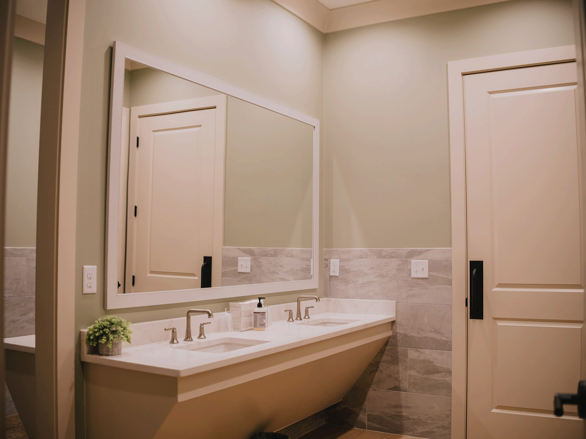 Bathroom with double sink vanity at The Bunk House Lodge in Jackson Mississippi