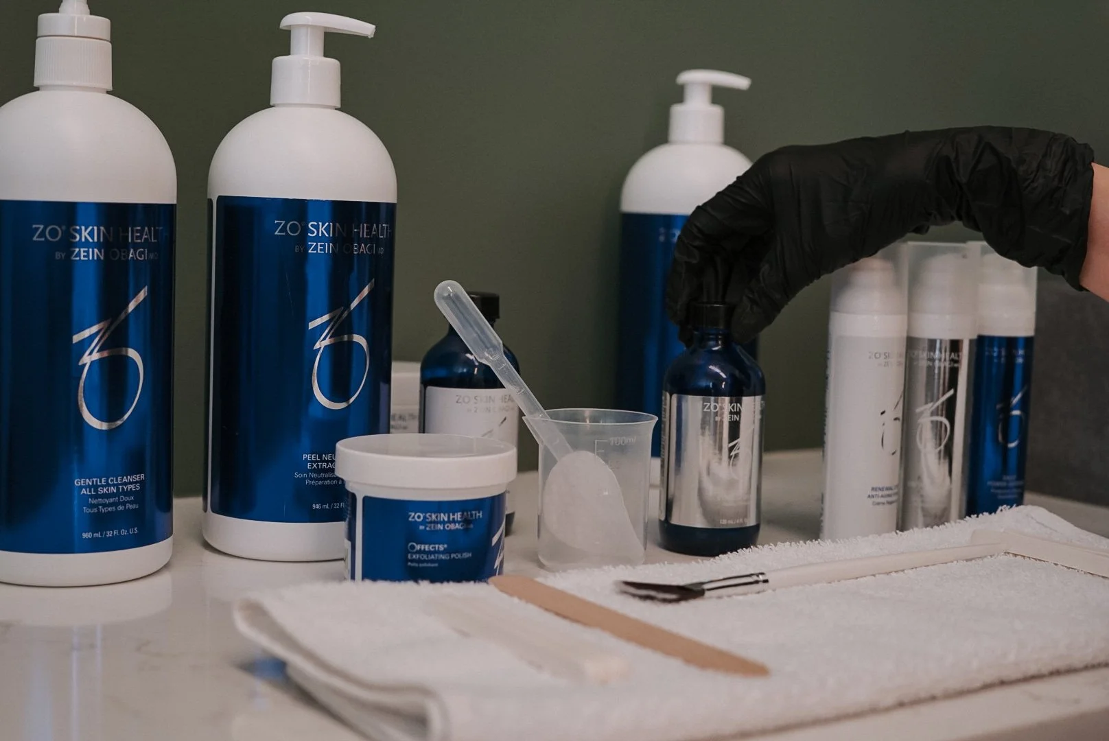 Professional ZO Stimulator Peel products prepared for treatment at Nude Skin & Laser in Langley, BC.