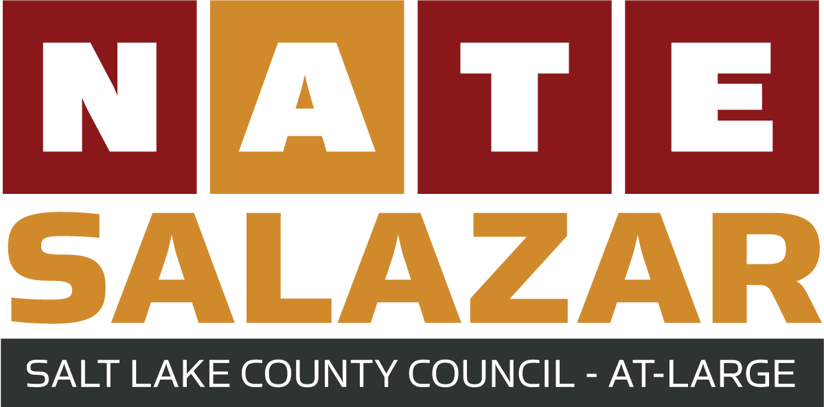 Logo for Nate Salazar, Salt Lake County Council at Large, with bold block letters in red, gold, and black.