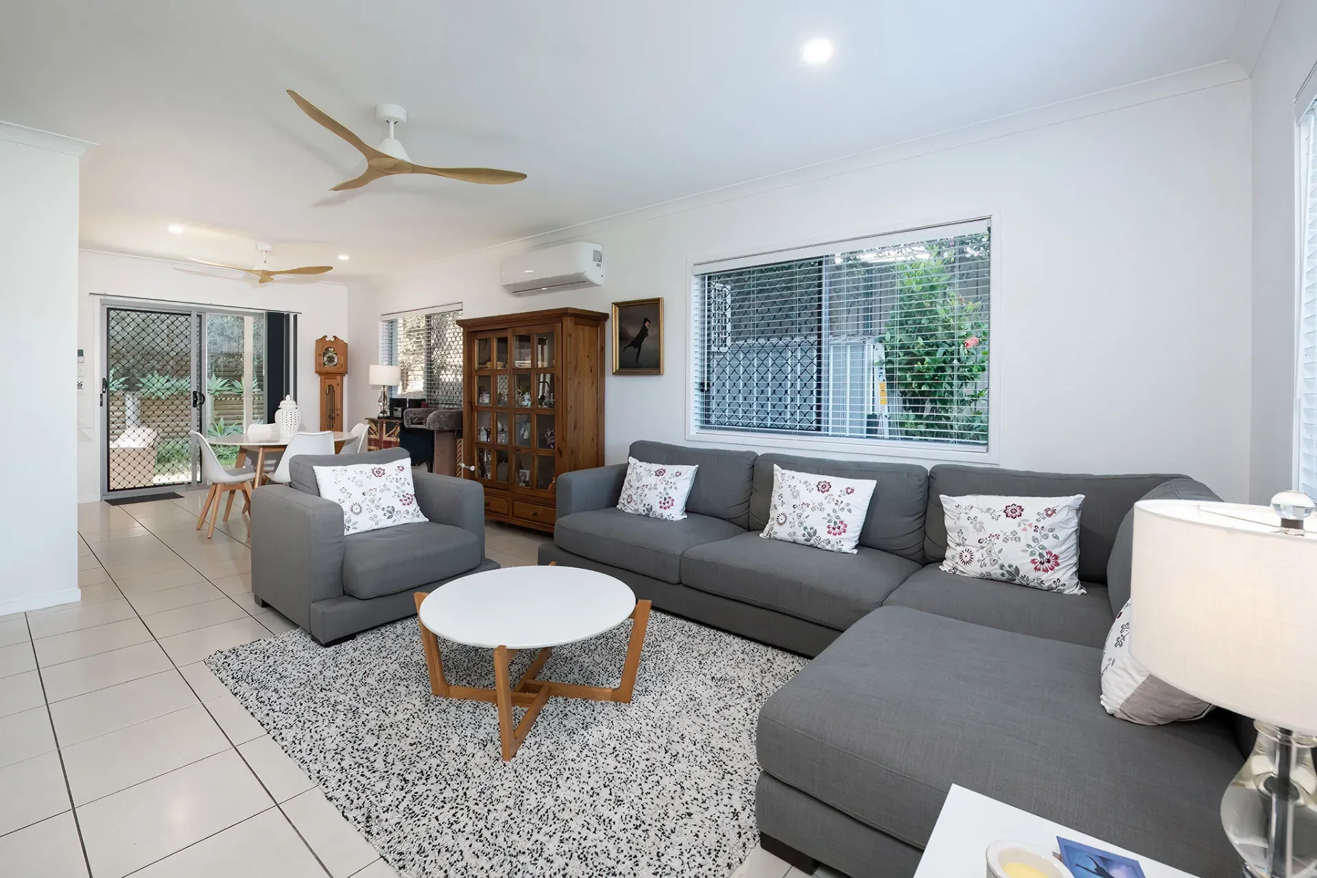 Modern living room with large sectional sofa, light styling and indoor-outdoor flow