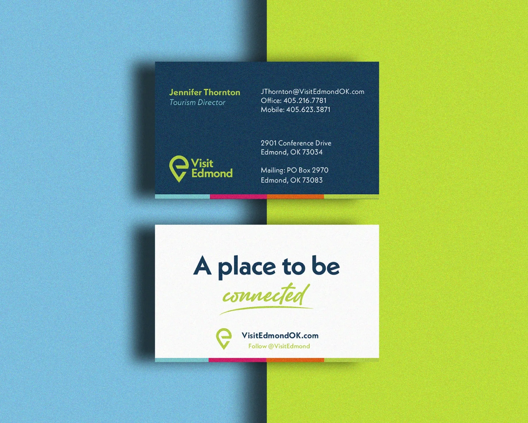 Business card for Jennifer Thornton, Tourism Director at Visit Edmond, placed above a sign that reads "A place to be connected." The background features blue, green, and yellow color blocks.