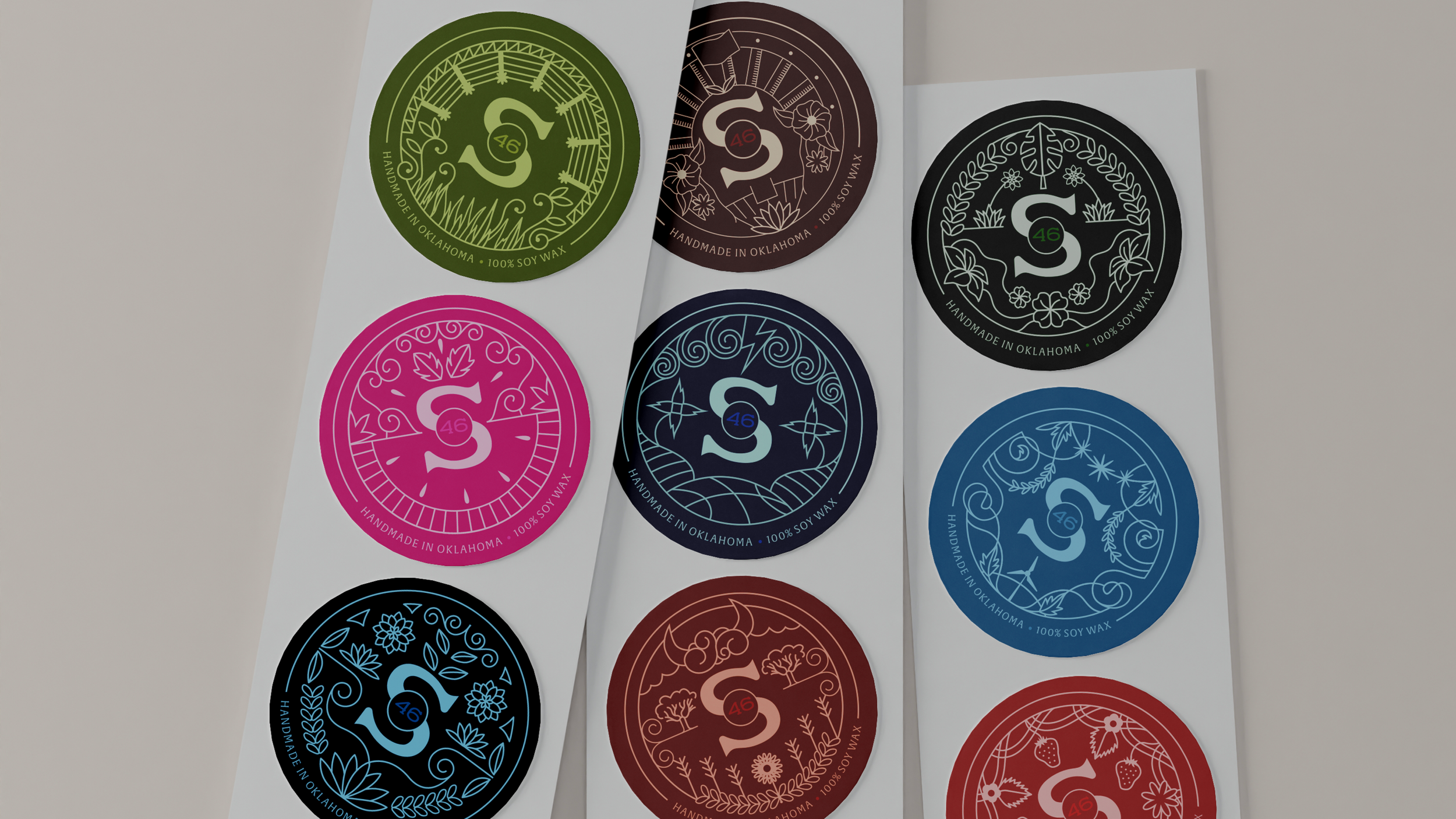 Collection of nine round wax seals with floral and nature-themed designs, each labeled 46, on white backing sheets.
