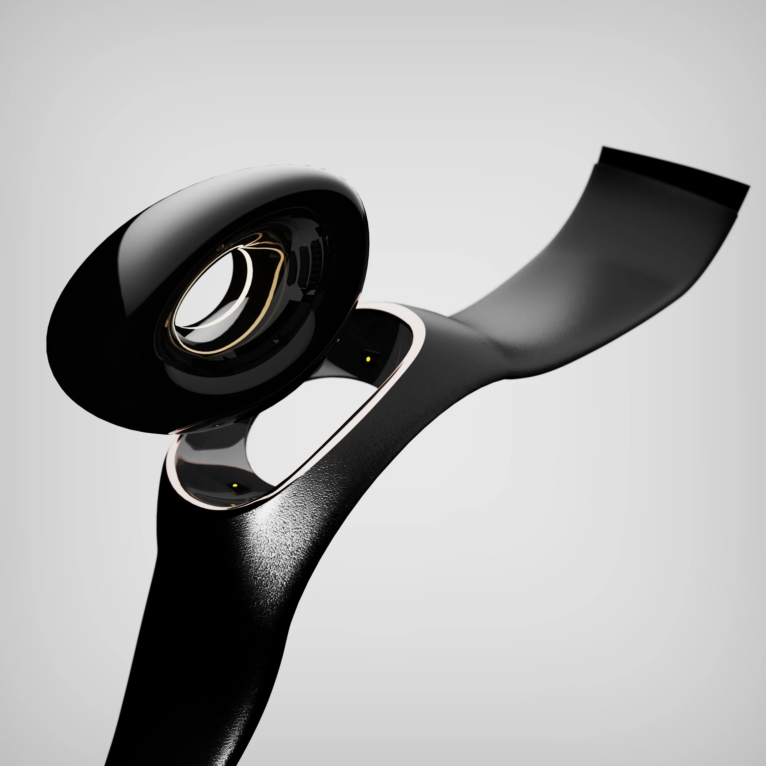 Close-up of a black wireless earbud resting on a black textured stylus against a plain background.