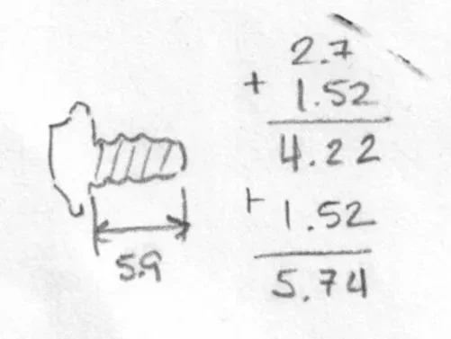 Handwritten diagram and mathematical calculations, showing a labeled sketch of a cylindrical object with a 5.7 mm diameter and summing some measurements to total 5.74.