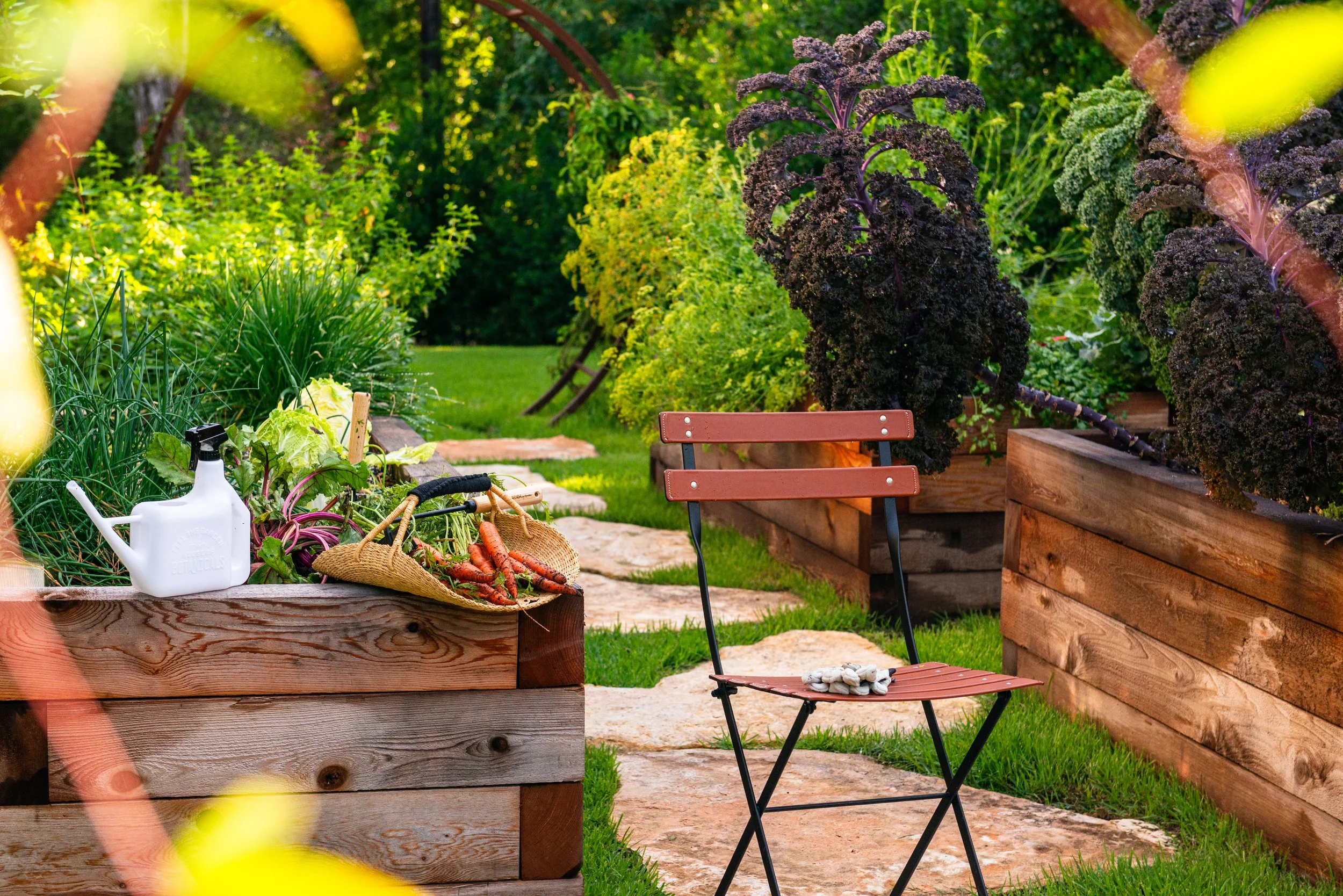 Custom cedar raised beds create an inviting, accessible edible garden where the family can learn, grow, and harvest together. We planted the garden alongside the children, combining their favorite vegetables with thoughtful companion plantings design