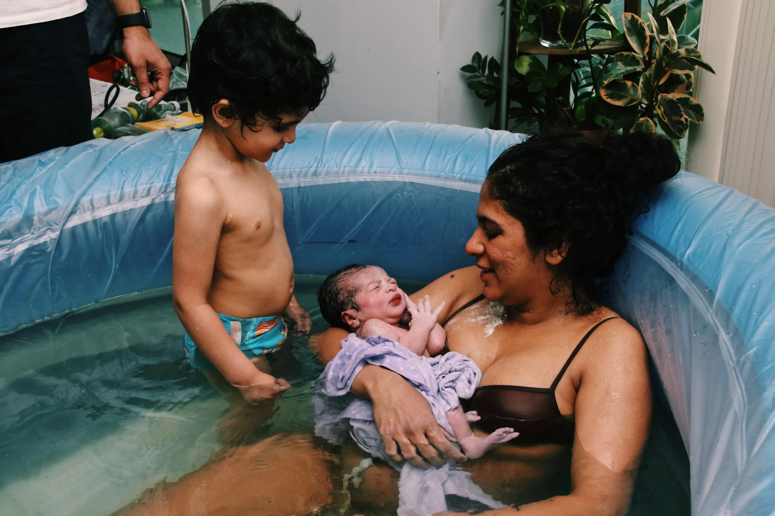 Partner support during a mindful waterbirth experience in the Southern Georgian Bay region.