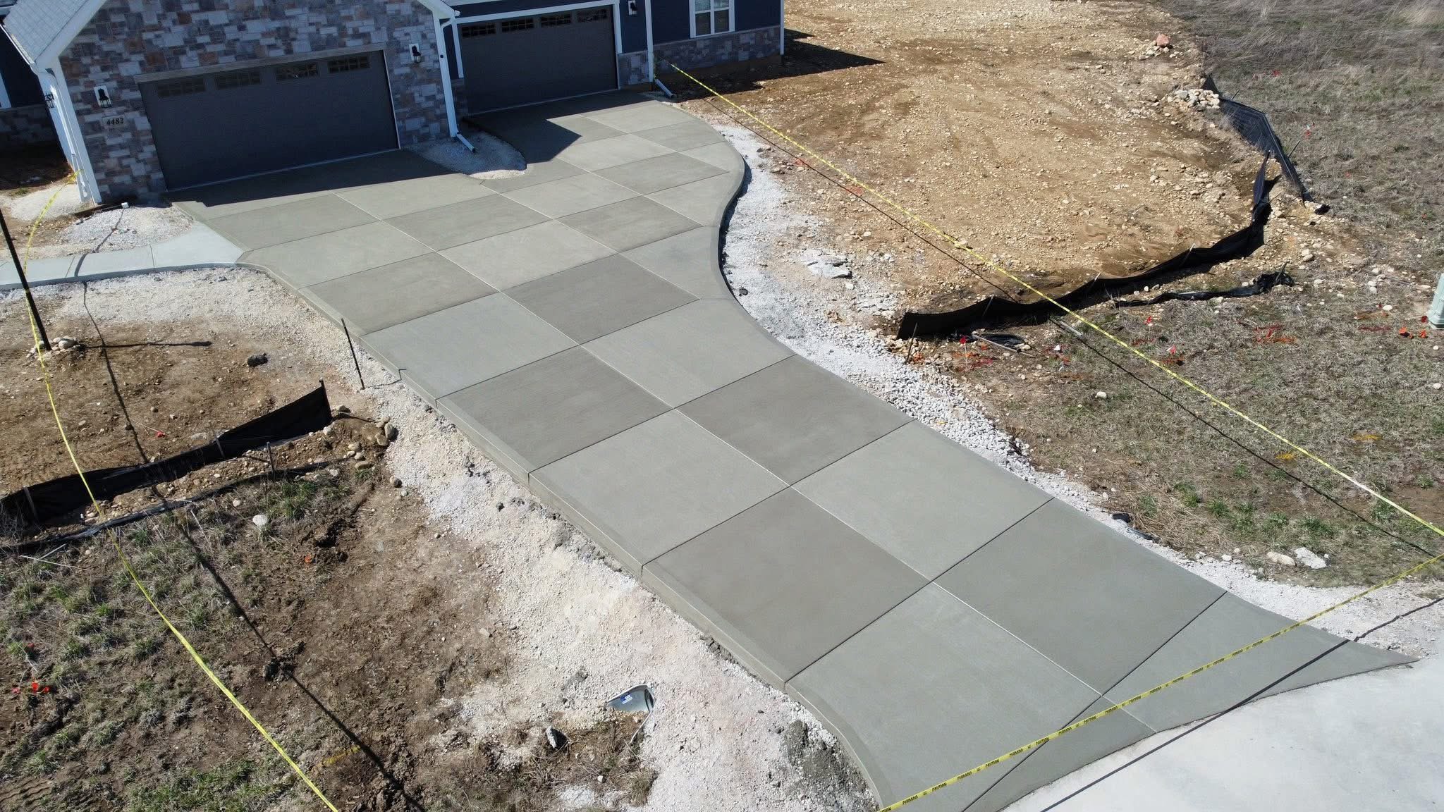An existing driveway reinforced and restored to provide a smoother, more durable surface.