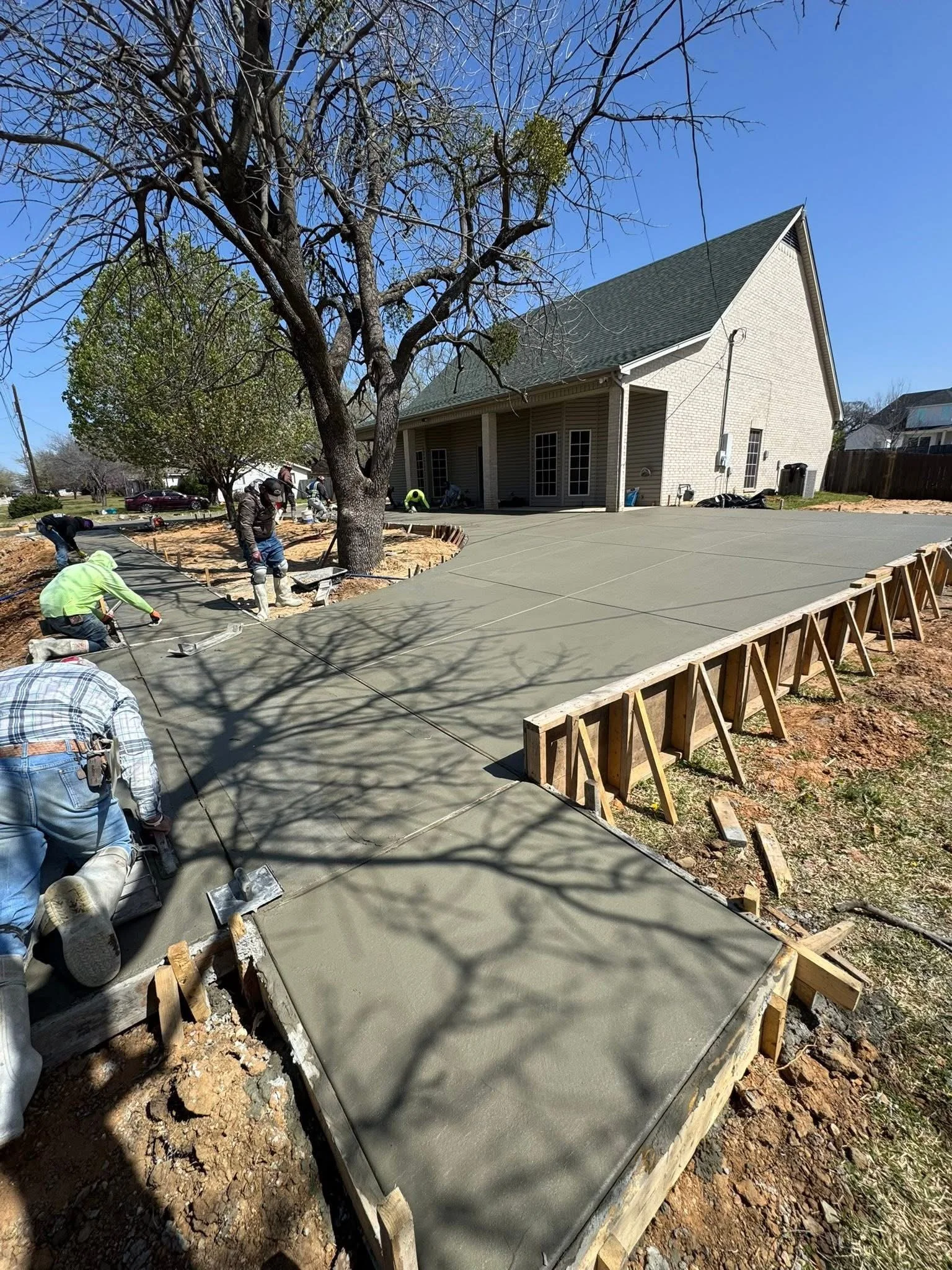 A complete concrete upgrade improving both the driveway and sidewalk for long-term performance and visual appeal.