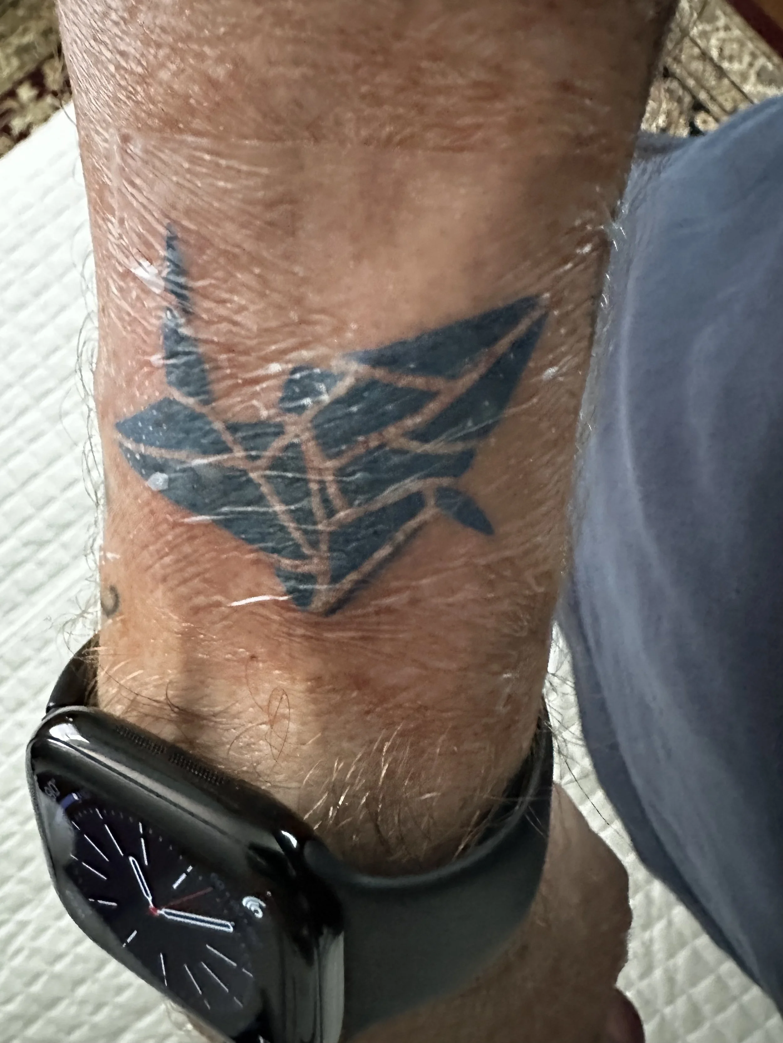 An origami paper crane tattoo