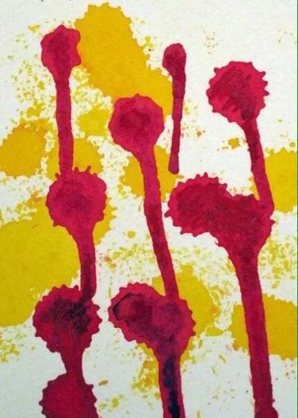 Red and yellow drops on a white background