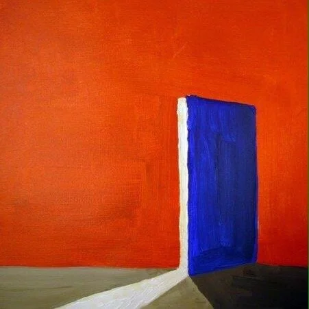 A Blue Door in an Orange Wall.