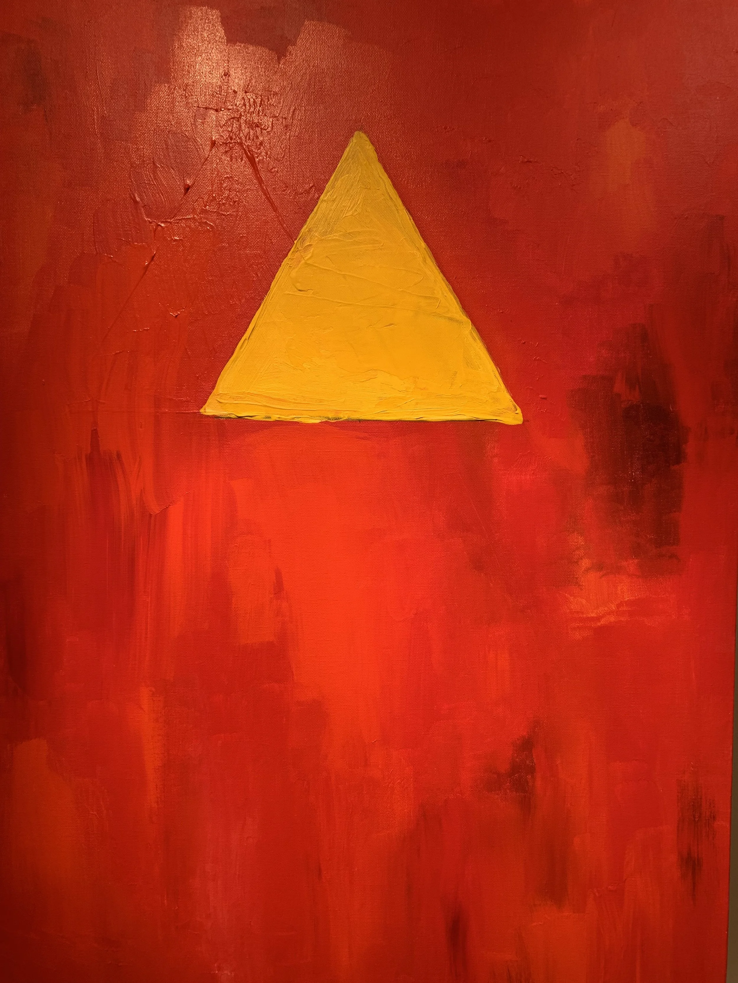 Yellow triangle on a red background
