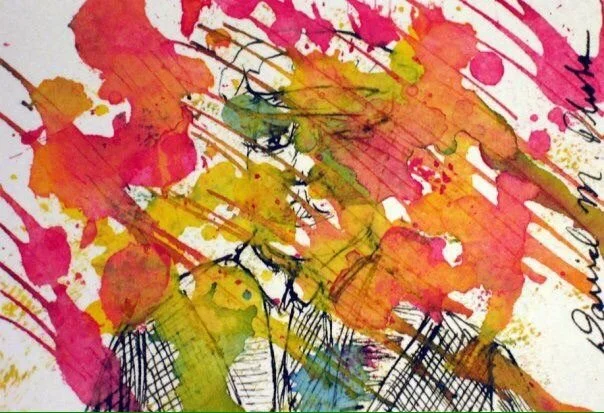 Face cover with red and yellow drops