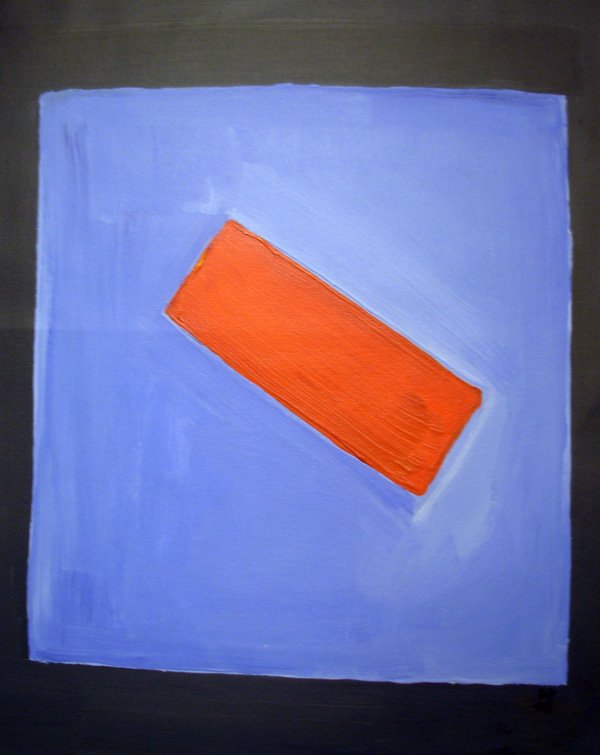 AN orange post it note on a blue and black background