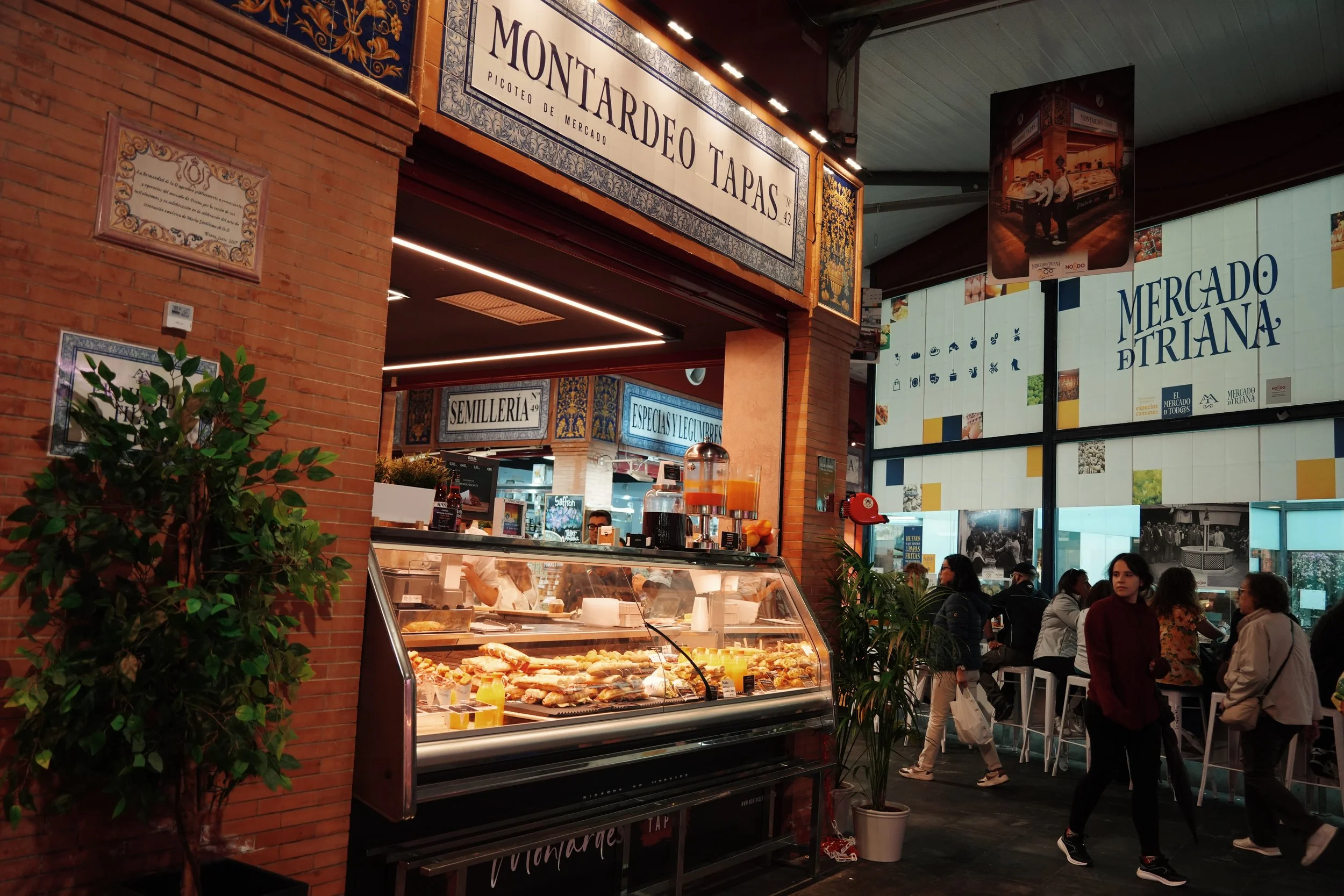 traina market in seville, spain- a must-see mercado featuring lots of andalucian food and fresh ingredients, must be on your seville travel itinerary