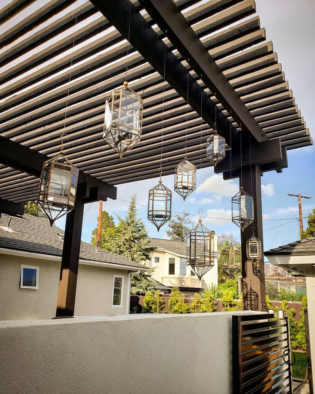 Spring is here! Want to add some romantic touches to you outdoor space? This can be done by hanging lanterns in groups, this can also create a division between two spaces while being pleasing to the eye. 
Special thanks to @builder.boy for pulling to