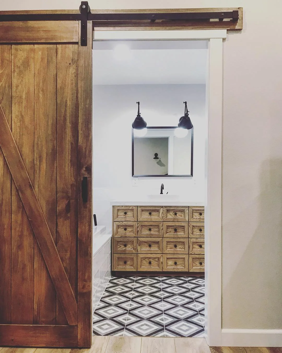 Remodel of the master bathroom. Amazing barn door install and apothecary cabinet. Clean lines, neutral color tiles and wood details makes for a quit retreat at home. If your not a fan of cords and wires, this smart and easy fix will solve the trick.
