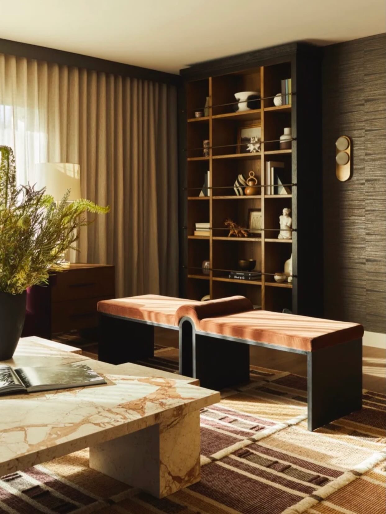 Some rooms don&rsquo;t shout for attention. They pull you in.

Layered textures, sculptural seating, warm wood tones, and stone that feels collected rather than installed. The goal here wasn&rsquo;t just to design a space&hellip; it was to design a f