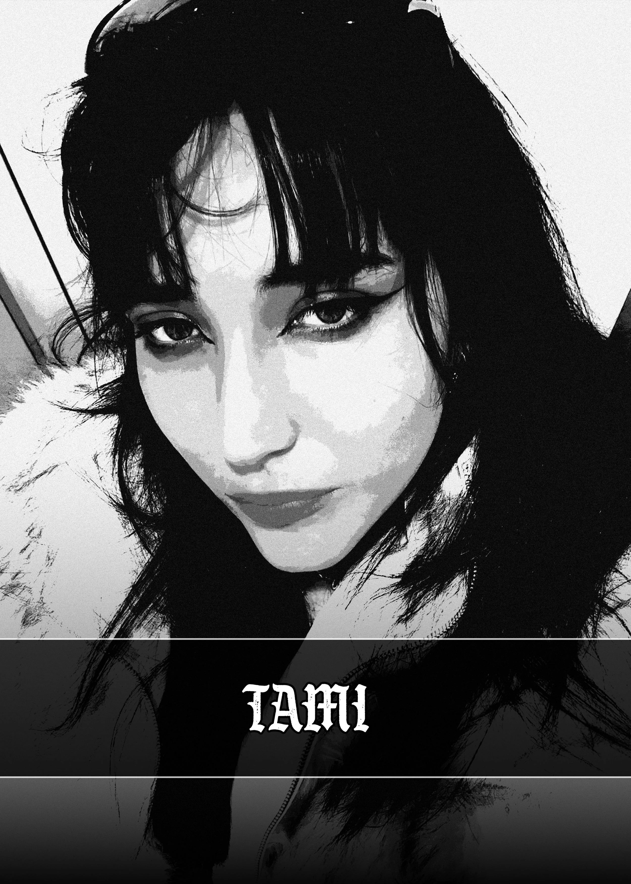 Black and white close-up photo of a tattoo artist woman named Tami with dark hair and bold makeup, wearing a hoodie with the word 'TRUE' printed upside down on the front.