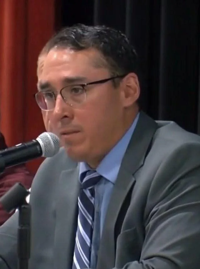 Adam leads a Village Board meeting during the 2025 Williams Bay water crisis