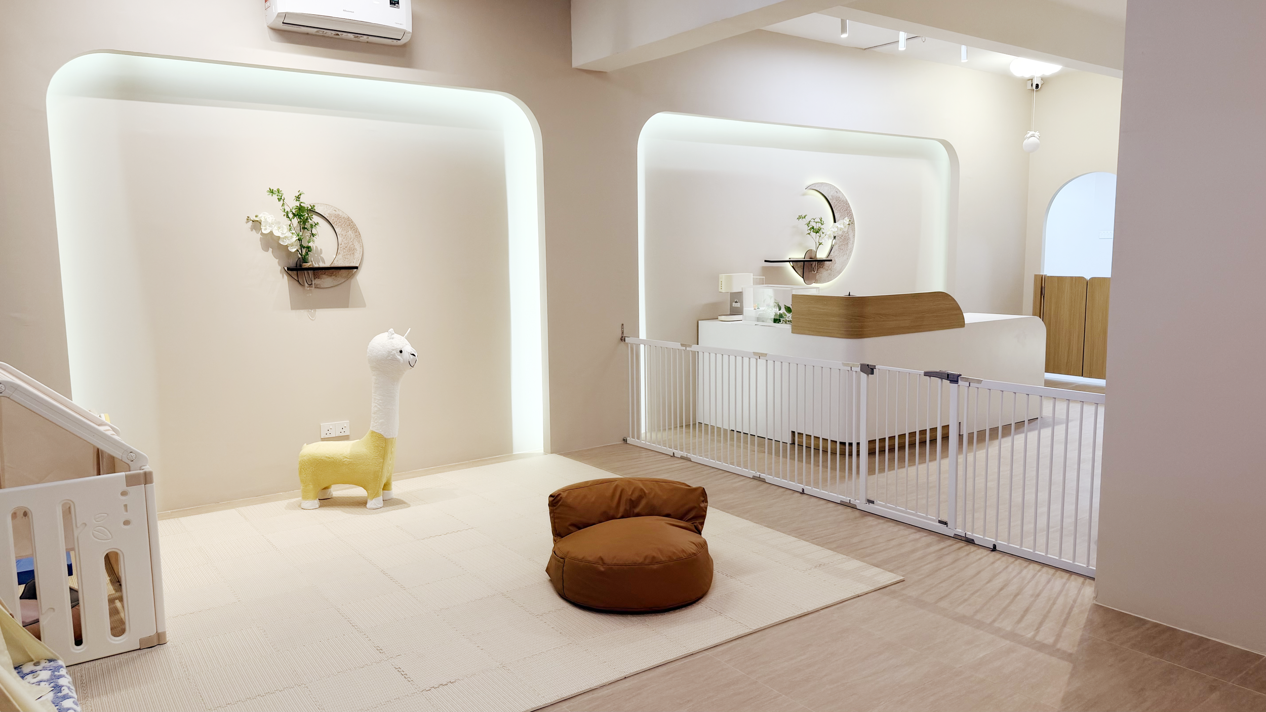 A clean, safe, and supervised play area at Pet Atas holistic pet care, featuring comfortable mats and soft lighting for dog well-being.