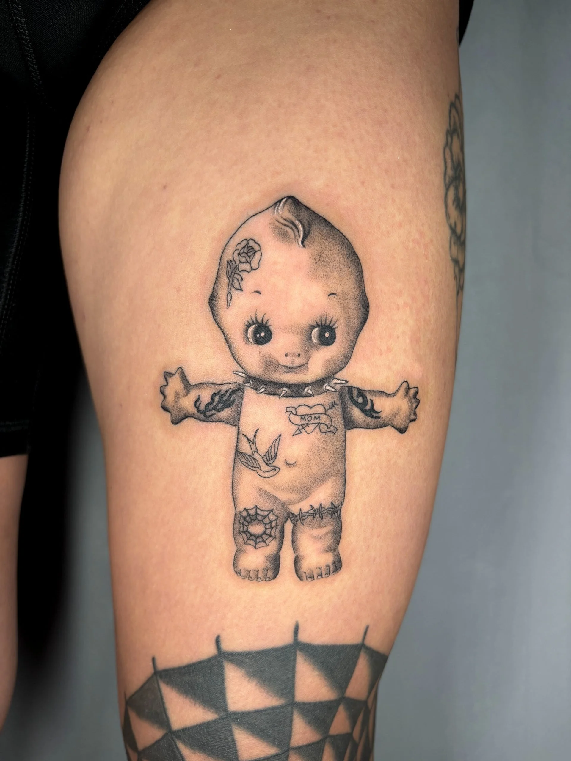 kewpie_baby_traditional_microrealism_tattoo-scaled.jpg
